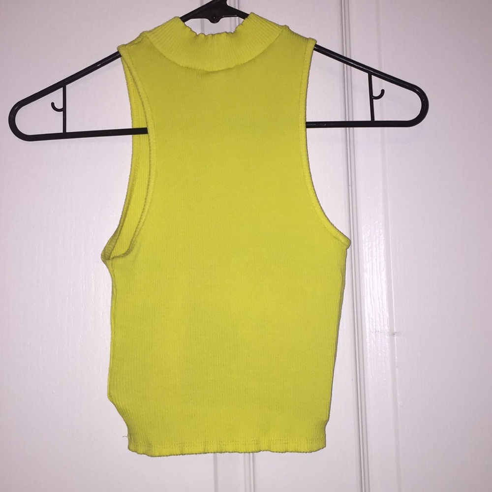 Yellow sleeveless turtleneck